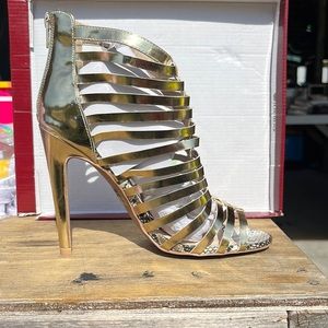 Gladiator style gold heel . Never been worn